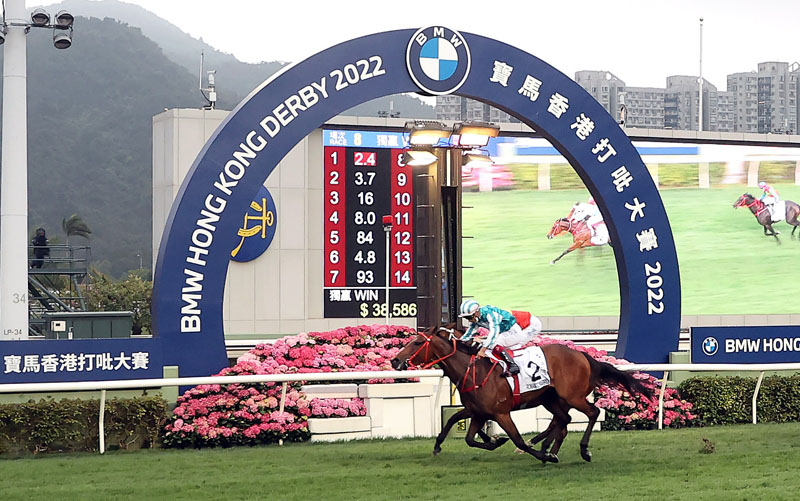 The Danny Shum-trained Romantic Warrior, ridden by Karis Teetan, takes the BMW Hong Kong Derby (2000m), the final leg of the Four-Year-Old Classic Series, at Sha Tin Racecourse.