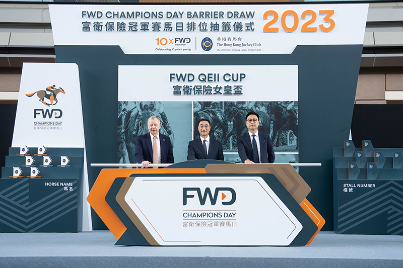 From left: Mr Winfried Engelbrecht-Bresges, Chief Executive Officer of the HKJC, Mr Michael Lee, Chairman of The HKJC and Mr Paul Tse, Chief Marketing & Digital Officer of FWD HK & Macau, officiate at the 2023 FWD Champions Day barrier draw ceremony in the Parade Ring at Sha Tin Racecourse.