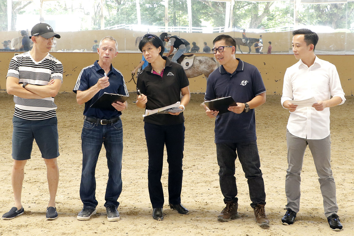 (From left) Assistant trainer Cody Mo; Felix Coetzee, Chief Riding Instructor of Apprentice Jockeys’ School; Amy Chan, Racing Development Board Executive Manager and Headmistress of the Apprentice Jockeys’ School; trainer Dennis Yip and assistant trainer Gabriel Lee select talented applicants at the riding test.