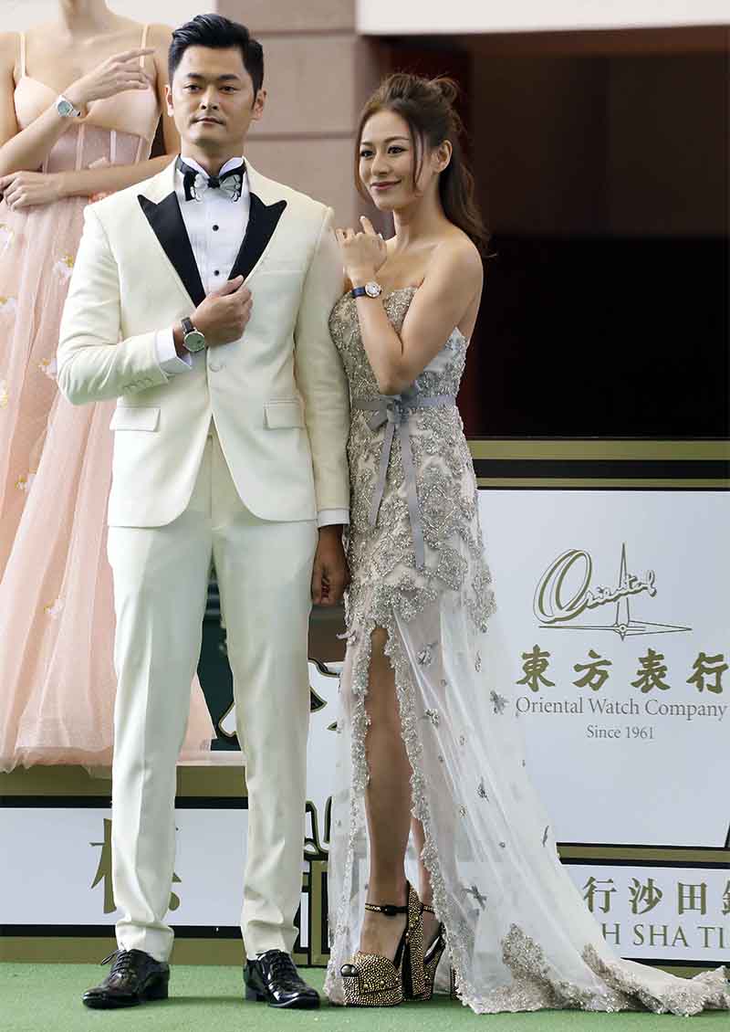A Watch & Fashion Show is held at the Parade Ring at Sha Tin Racecourse. Celebrity models Elanne Kwong and Oscar Siu take the lead on the runway, showing off evening wear by renowned fashion designer Pius Cheung.