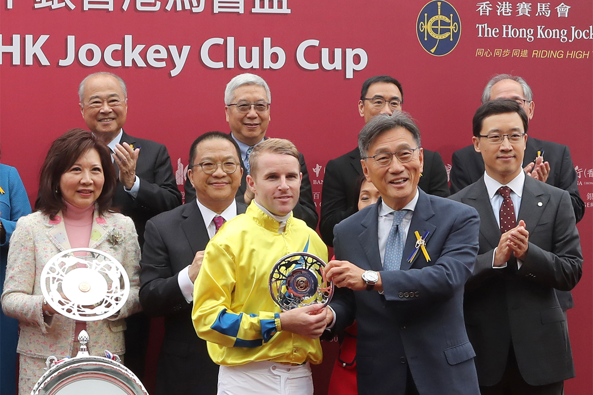 Club Steward Dr Christopher Cheng presents the BOCHK Jockey Club Cup trophy and silver dishes to the owner of Werther, Johnson Chen, trainer John Moore and jockey Tommy Berry.