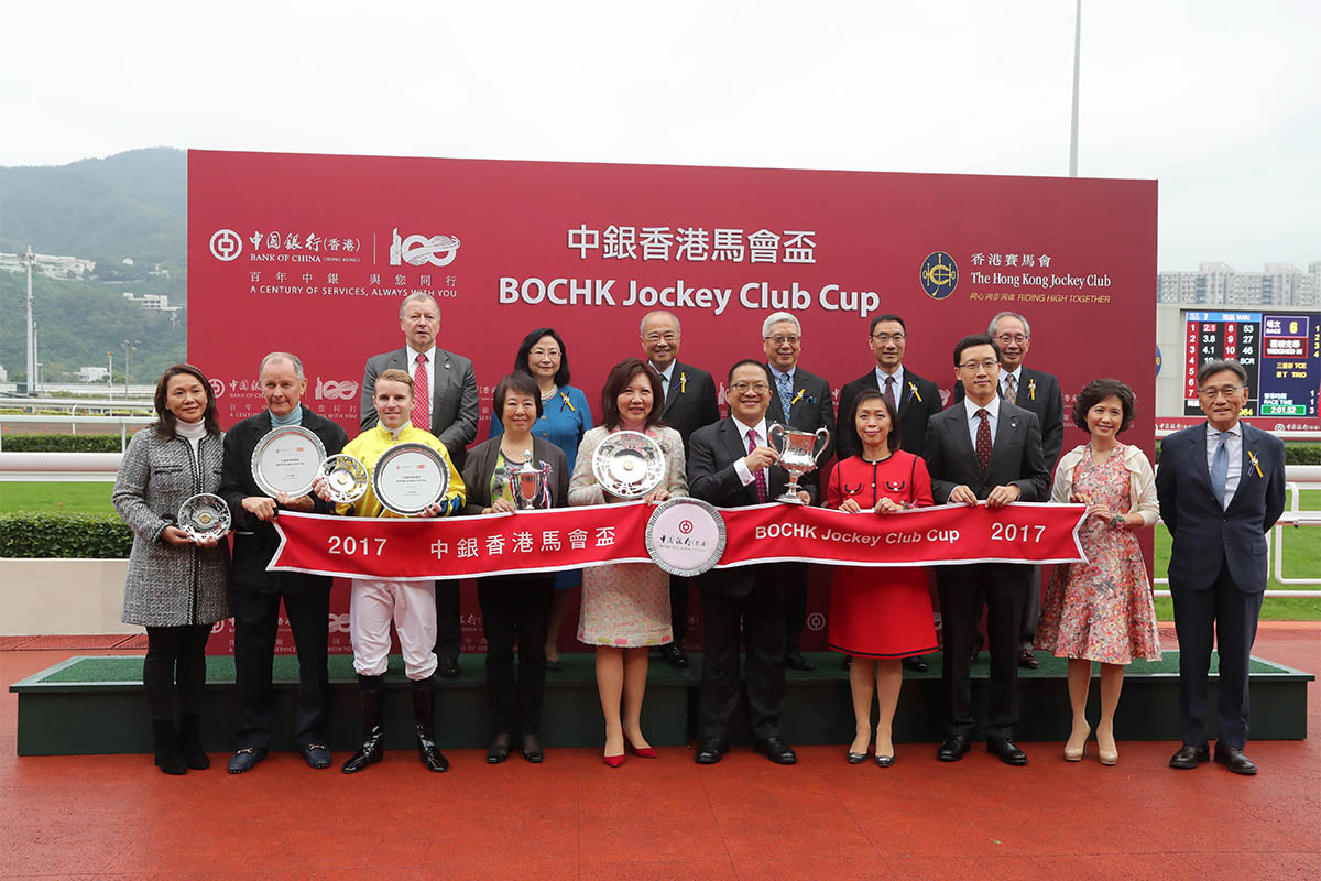 HKJC Stewards, Chief Executive Officer and presenting guests for the BOCHK Jockey Club Cup pose for a group photo with the winning connections of Werther.
