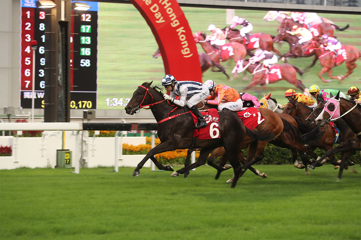 The Danny Shum-trained Seasons Bloom (No. 6), ridden by Joao Moreira, wins the G2 BOCHK Wealth Management Jockey Club Mile at Sha Tin Racecourse today.