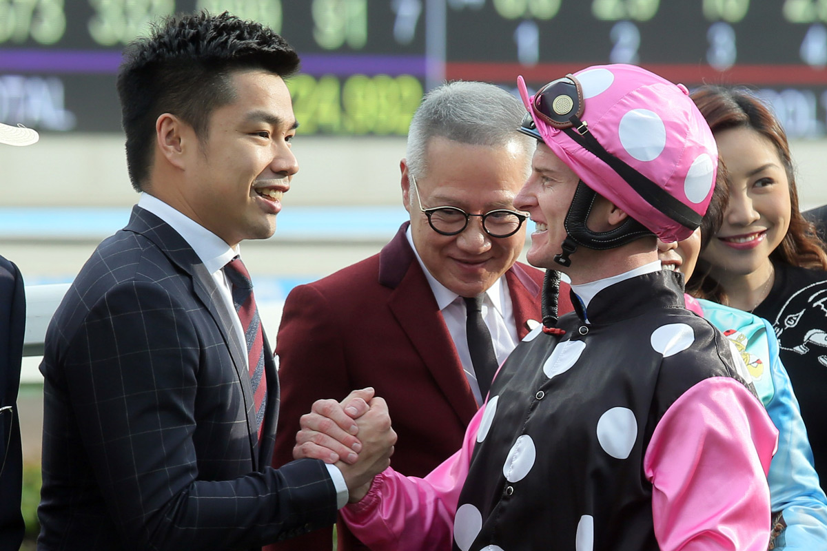 Connections of the winning horse, Beauty Generation, celebrate their success.