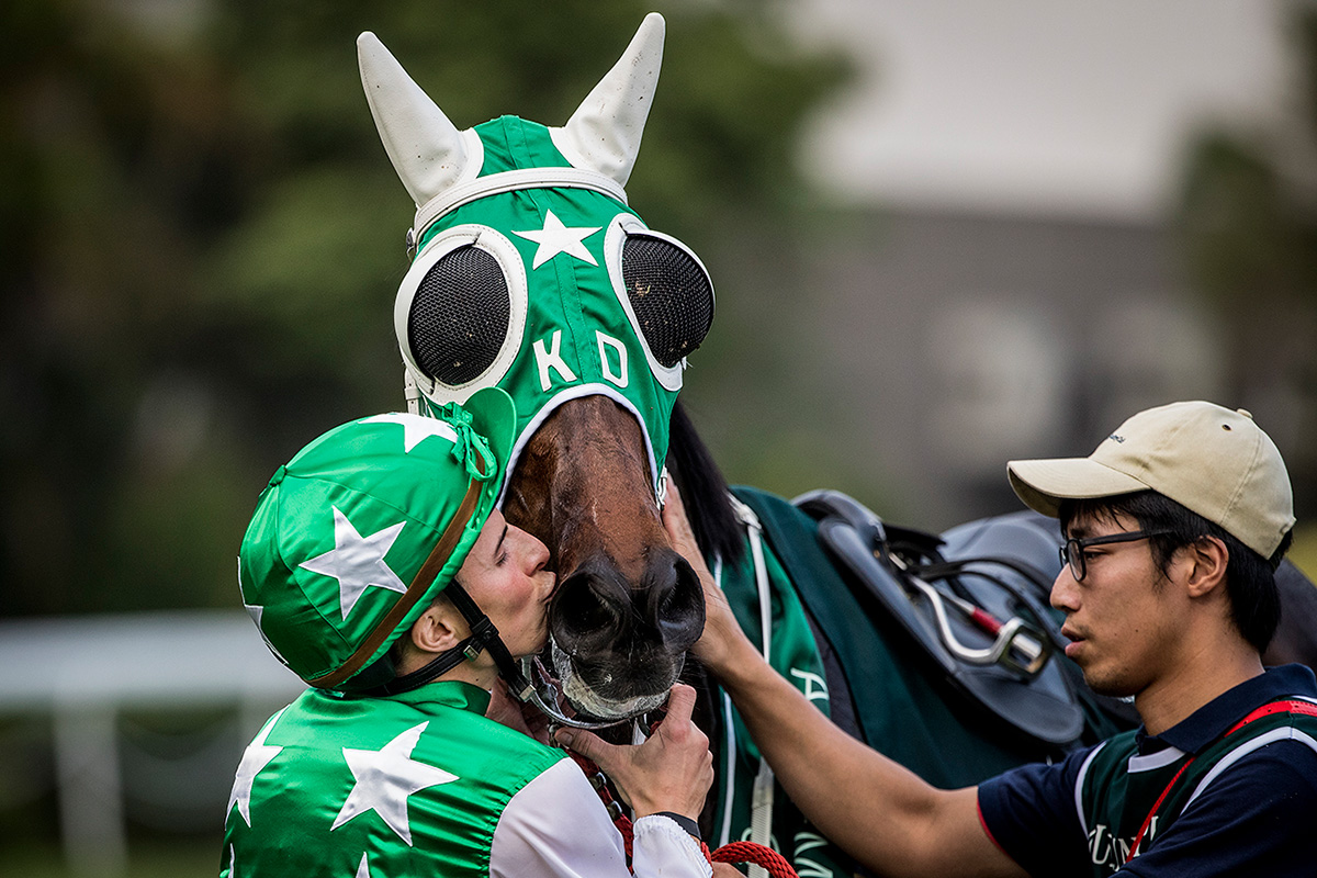 Connections of Pakistan Star celebrate their victory after the race.