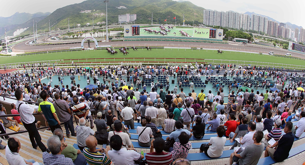 In the spirit of “Ma Zhao Pao” (racing will continue) racegoers enjoy the exciting races at Hong Kong Reunification Raceday.