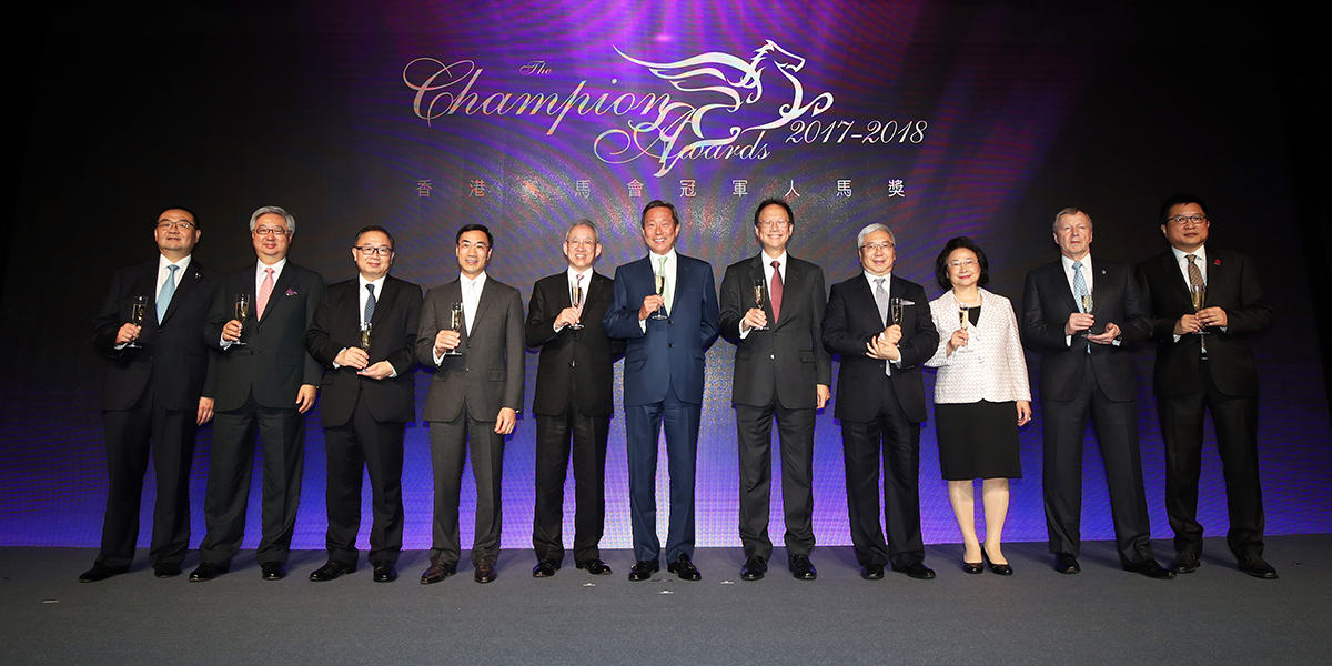 Officiating guests share a champagne toast to kick off the Champion Awards presentation ceremony for the 2017/18 racing season. From left: Mr. Benson Lo, President of the Hong Kong Racehorse Owners Association, Mr. Silas S S Yang, Steward of The Hong Kong Jockey Club, The Hon. Martin Liao, Steward of The Hong Kong Jockey Club, Mr. Michael T H Lee, Steward of The Hong Kong Jockey Club, Mr. Anthony W K Chow, Deputy Chairman of The Hong Kong Jockey Club, Dr. Simon S O Ip, Chairman of The Hong Kong Jockey Club, Mr. Philip N L Chen, Steward of The Hong Kong Jockey Club, Dr. Eric Li Ka Cheung, Steward of The Hong Kong Jockey Club, Mrs. Margaret Leung, Steward of The Hong Kong Jockey Club, Mr. Winfried Engelbrecht-Bresges, CEO of The Hong Kong Jockey Club, Mr. Carlos Wu, Chairman of the Association of Hong Kong Racing Journalists