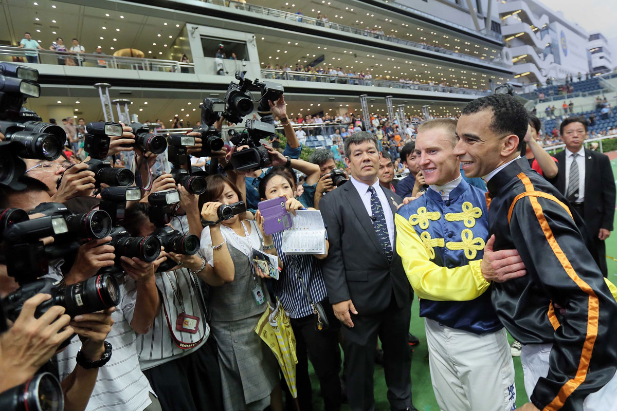 Riders Zac Purton and Joao Moreira congratulate each other after a hard-fought jockeys’ championship battle.