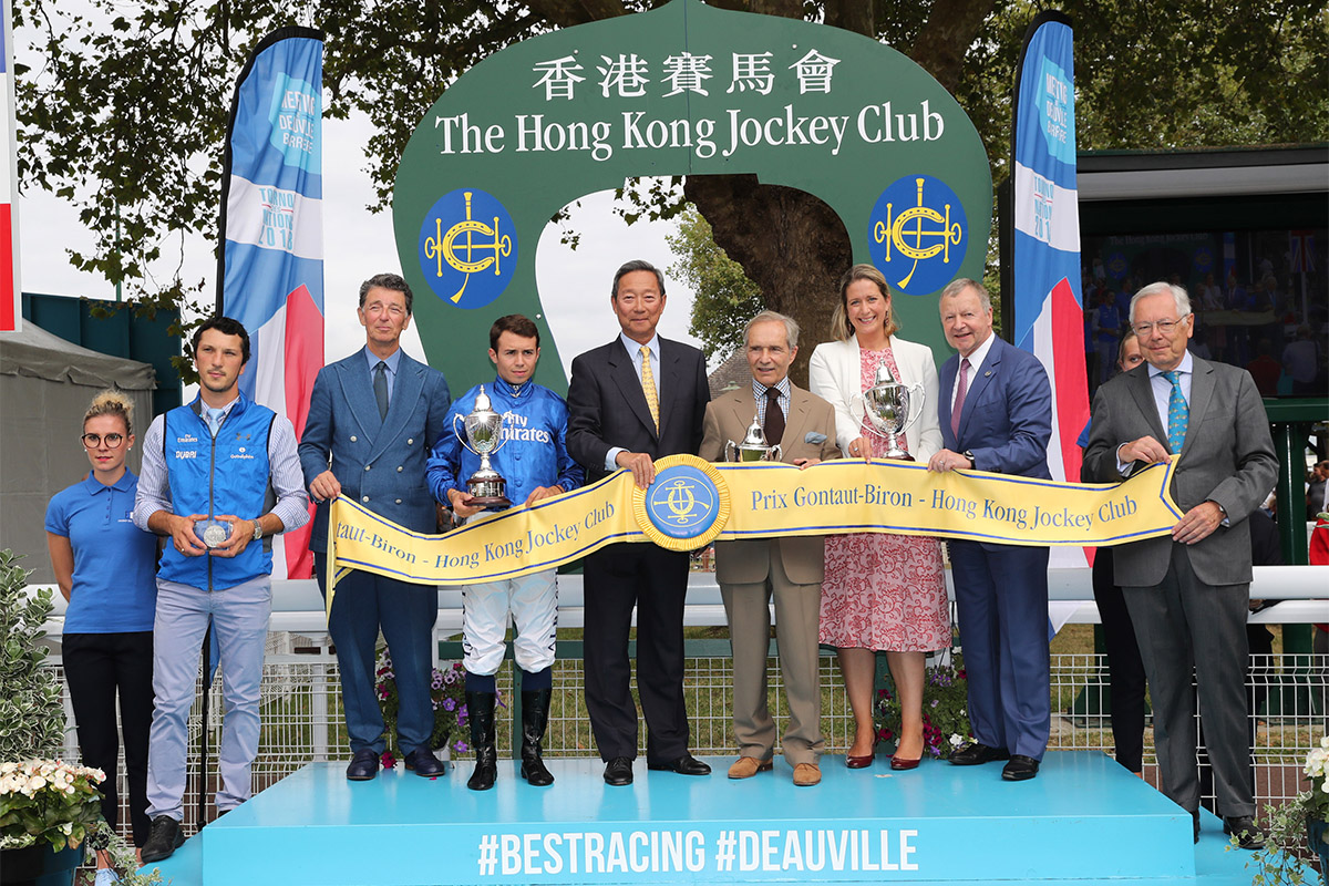 Dr. Simon Ip (centre), Chairman of the Hong Kong Jockey Club, stands for a photo with Edouard de Rothschild (third from left), President of France Galop, Jean-Pierre Colombu (first from right), Vice President of France Galop, and Hong Kong Jockey Club CEO Winfried Engelbrecht-Bresges (second from right), after presenting the Prix Gontaut-Biron Hong Kong Jockey Club trophy to the winning connections of Talismanic.