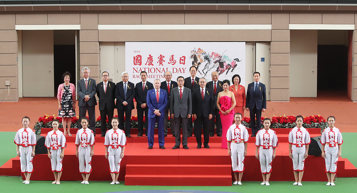 Zhao Jiankai, Deputy Commissioner of the Office of the Commissioner of the Ministry of Foreign Affairs of the People’s Republic of China in the HKSAR (front row, second from left), Club Chairman Anthony W K Chow (front row, third from left), Club Stewards and CEO Winfried Engelbrecht-Bresges (front row, first from left), officiate at the opening ceremony of the National Day Race Meeting at Sha Tin Racecourse.