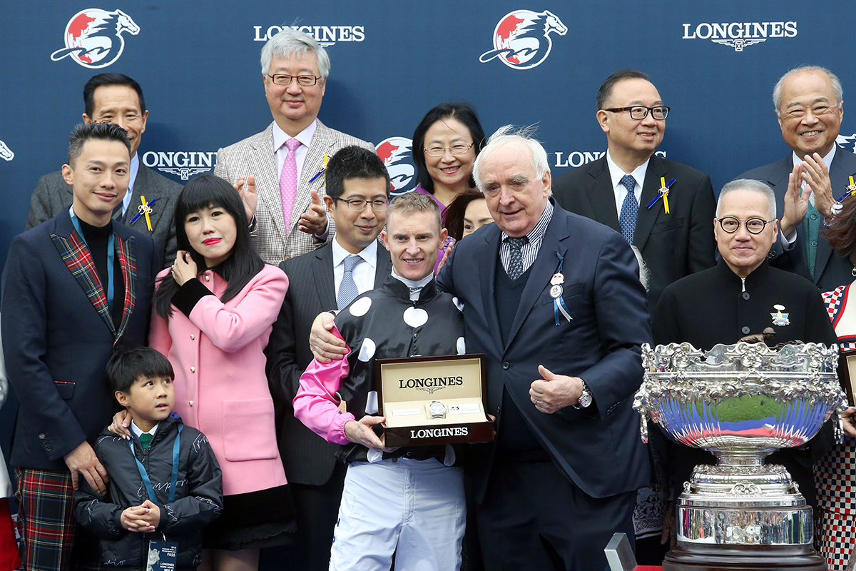 Mr Walter von Känel, President of LONGINES presents a LONGINES Conquest Classic Collection watch to Mrs Eleanor Kwok, owner representative of Beauty Generation, trainer John Moore and jockey Zac Purton.