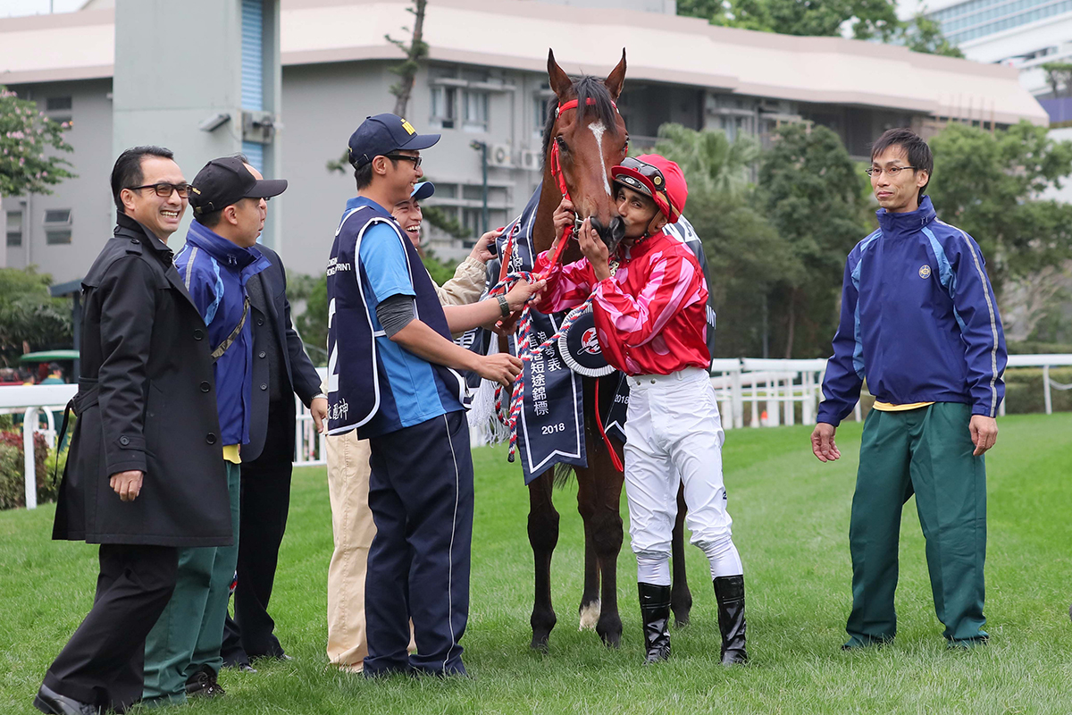 Mr Stunning’s jockey Karis Teetan, trainer Frankie Lor, owner’s friend and related connections celebrate their success after taking the LONGINES Hong Kong Sprint.