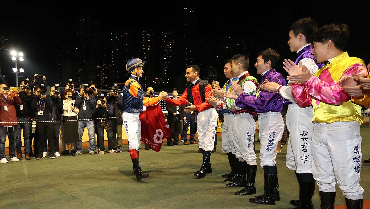 Douglas Whyte and Joao Moreira clasp hands as the jockeys’ room empties for a guard of honour.