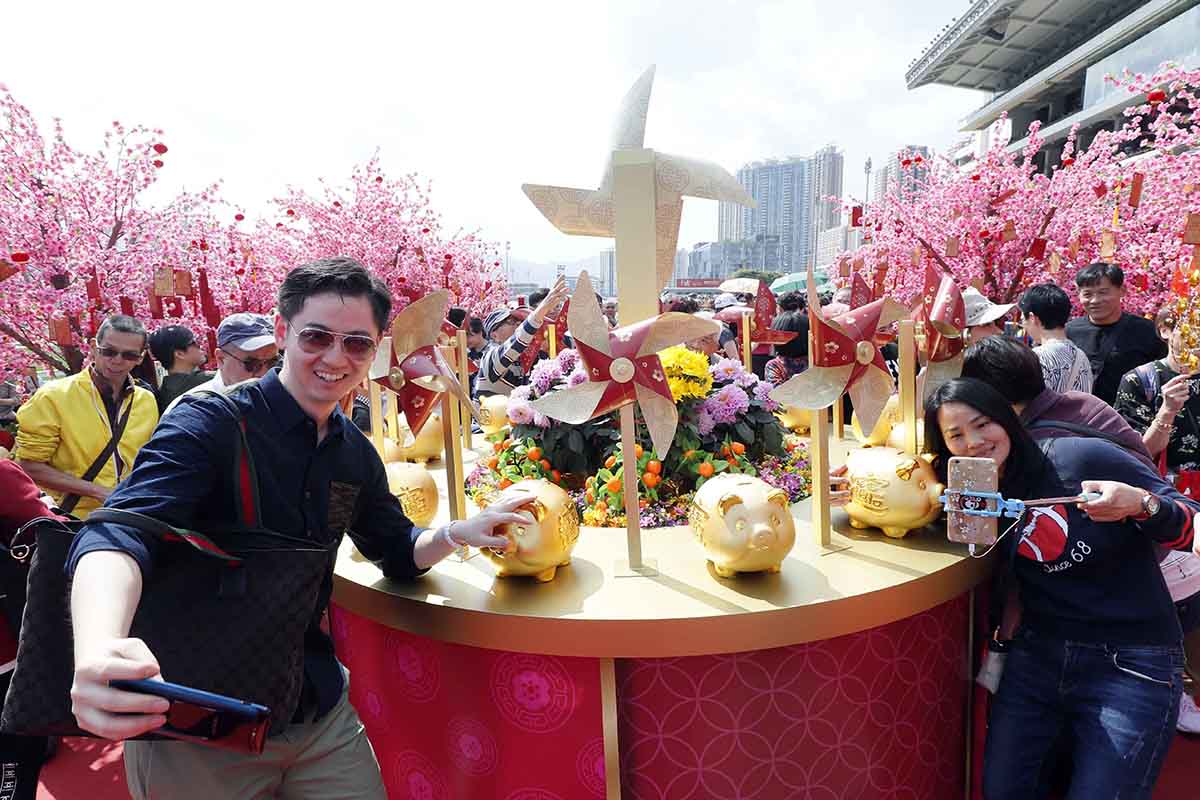 A lucky windmills and blossom display at the racecourse bring blessings for a prosperous year.