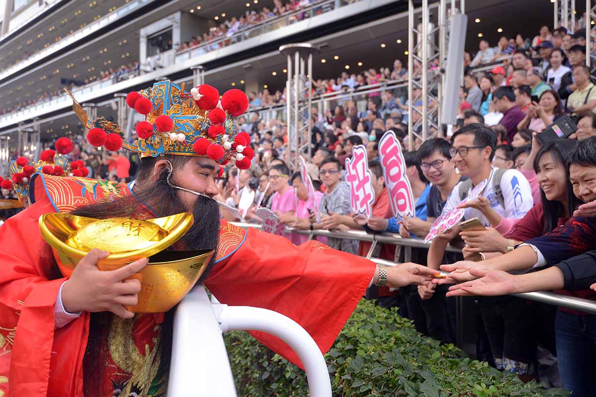 Race goers enjoy the festive atmosphere at the Chinese New Year Raceday at Sha Tin.