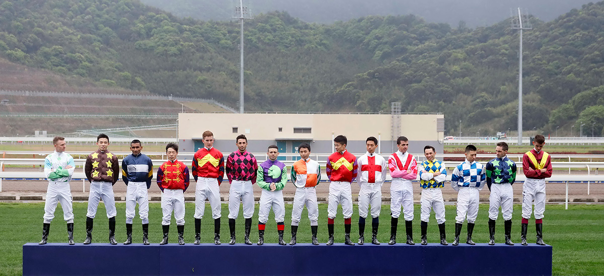 The 15 jockeys taking part in the day’s races are introduced to the audience on the turf.