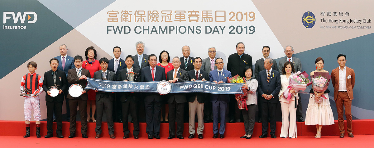 All pose for a group photo at the FWD QEII Cup trophy presentation ceremony.