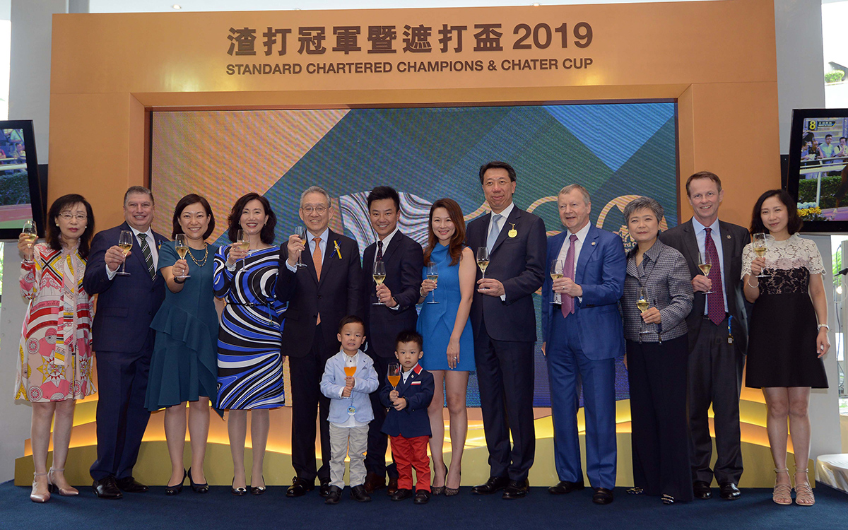 Representatives of The Hong Kong Jockey Club and Standard Chartered Bank, together with the connections of winning horse Exultant, toast the success of the Standard Chartered Champions & Chater Cup.