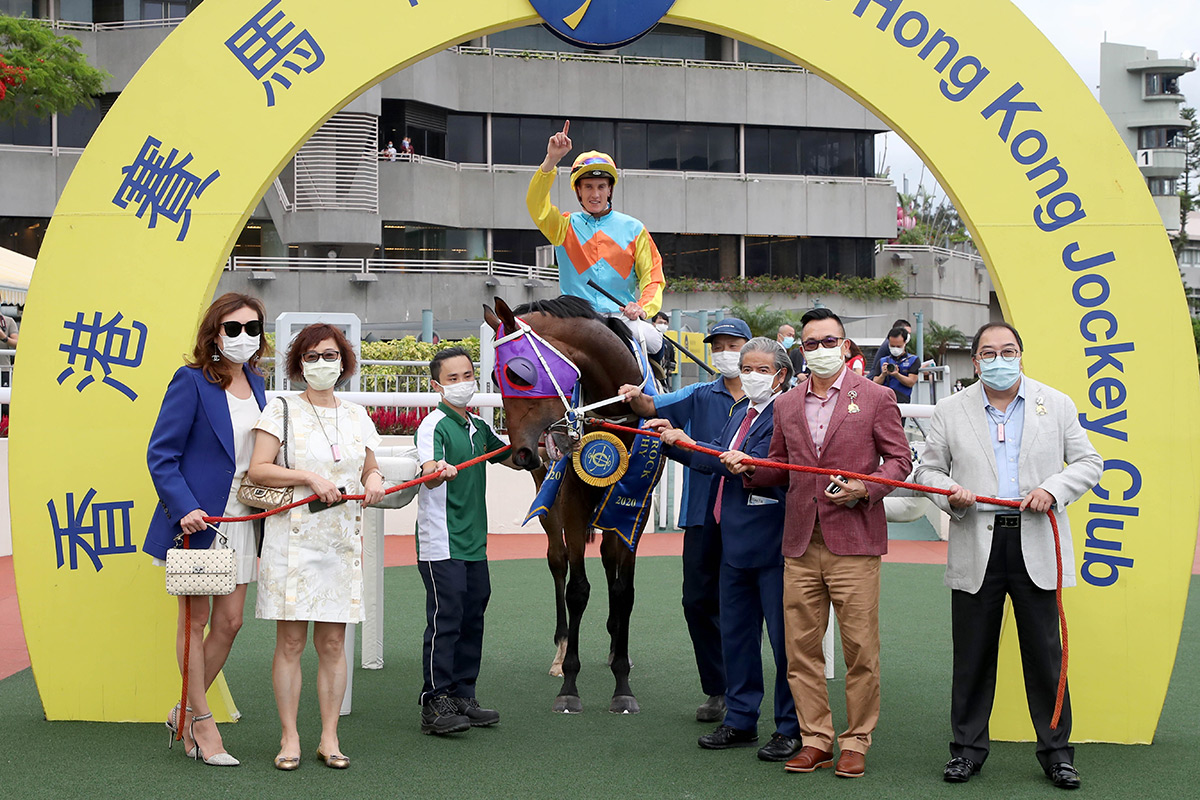 Connections of Ka Ying Star pose for a winning photo after the race.