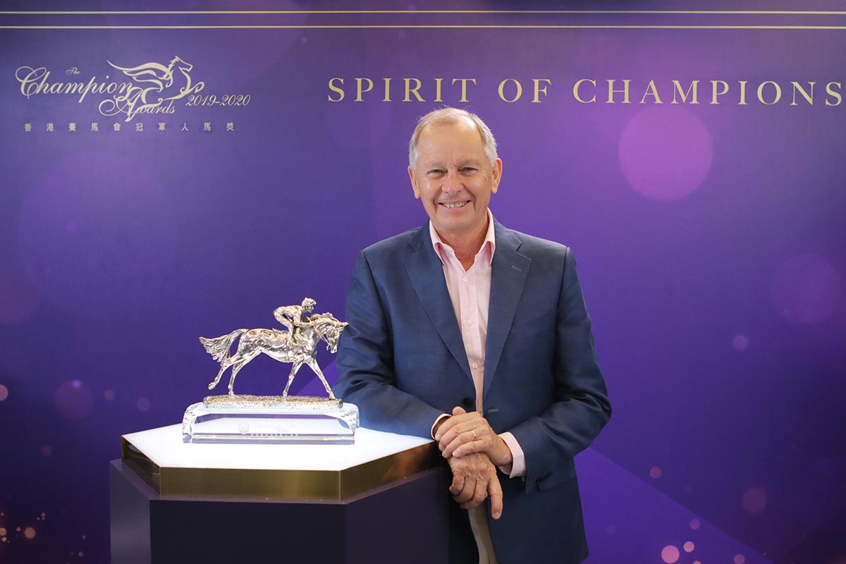Mr. Michael T H Lee, Deputy Chairman of The Hong Kong Jockey Club, announces the Lifetime Achievement Award goes to trainer John Moore for his great contribution to Hong Kong racing.