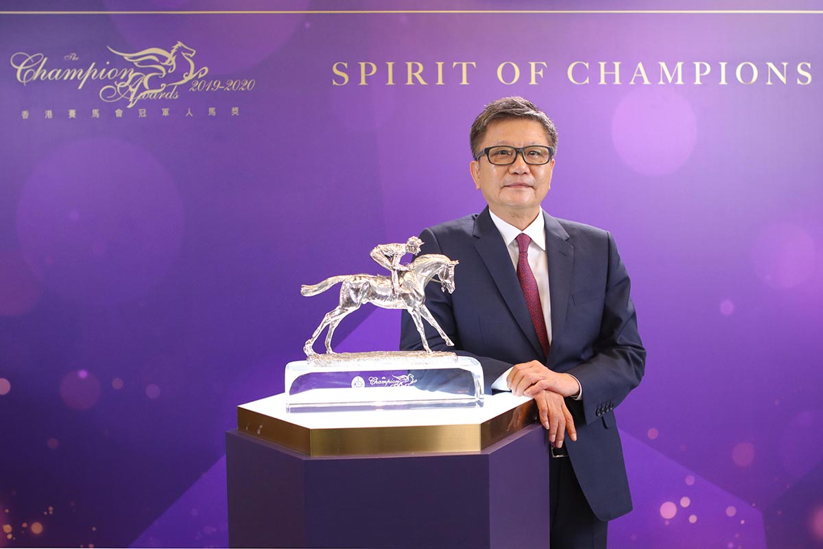 Exultant is crowned Horse of the Year. Mr. Philip N L Chen, Chairman of The Hong Kong Jockey Club, announces the award goes to owners Mr. Eddie Wong Ming Chak and Mrs. Wong Leung Sau Hing.