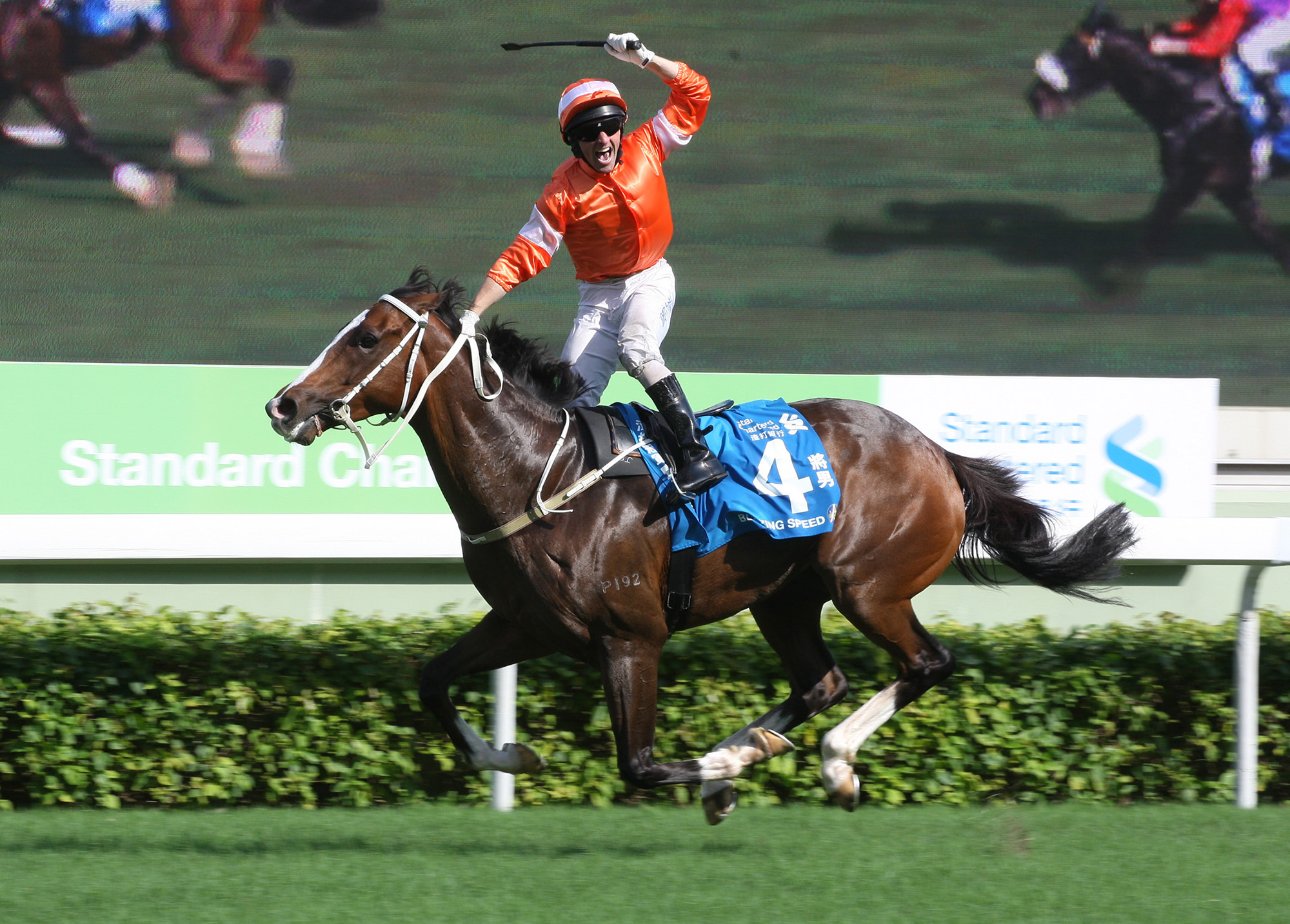 Callan celebrates the win aboard Blazing Speed in the 2014 Standard Chartered Champions & Chater Cup.