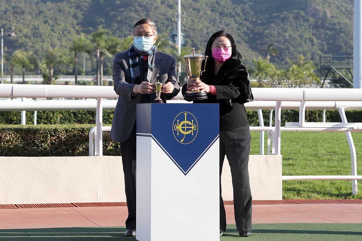 Dr Arthur Leung and Mrs Margaret Leung, owners of Champion's Way, pose for a photo with the Chinese Club Challenge Cup winning trophy.