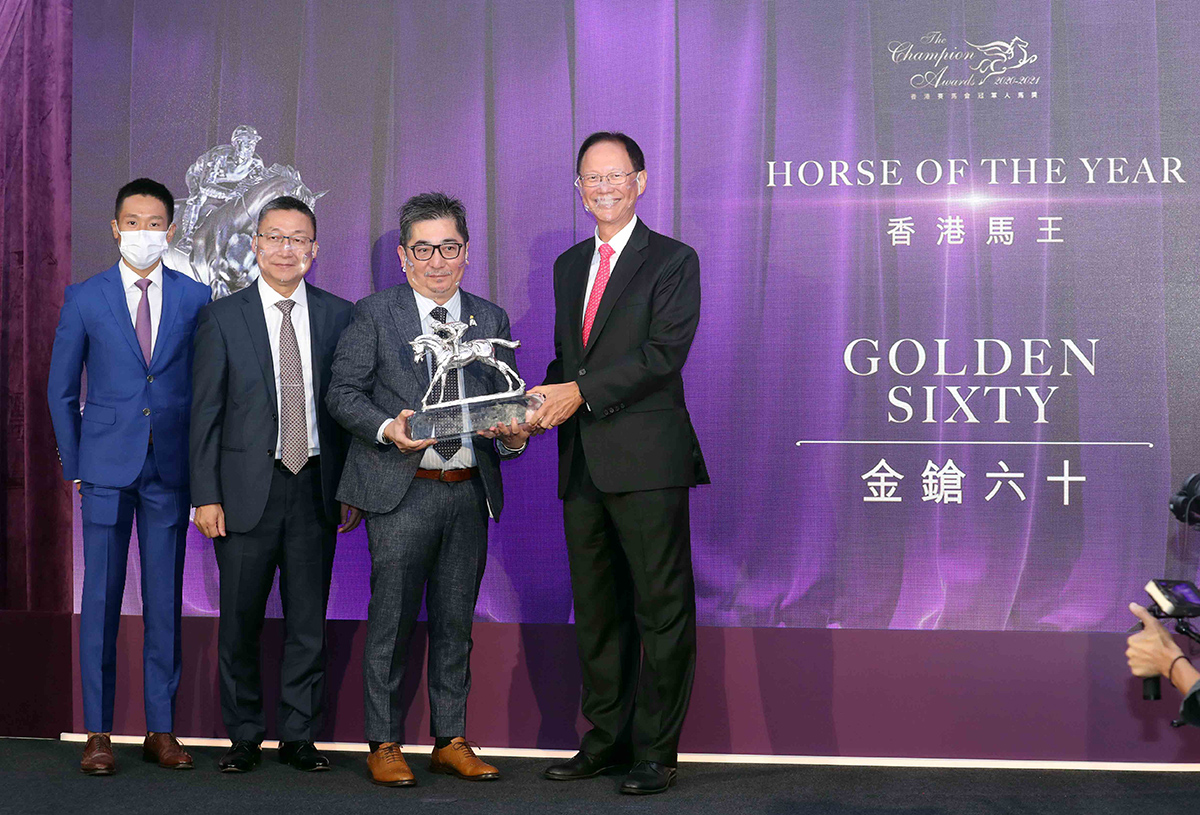 Golden Sixty is crowned Horse of the Year: Mr. Philip Chen, Chairman of The Hong Kong Jockey Club, presents the trophy to owner Stanley Chan Ka Leung; the owner is accompanied by trainer Francis Lui and jockey Vincent Ho.