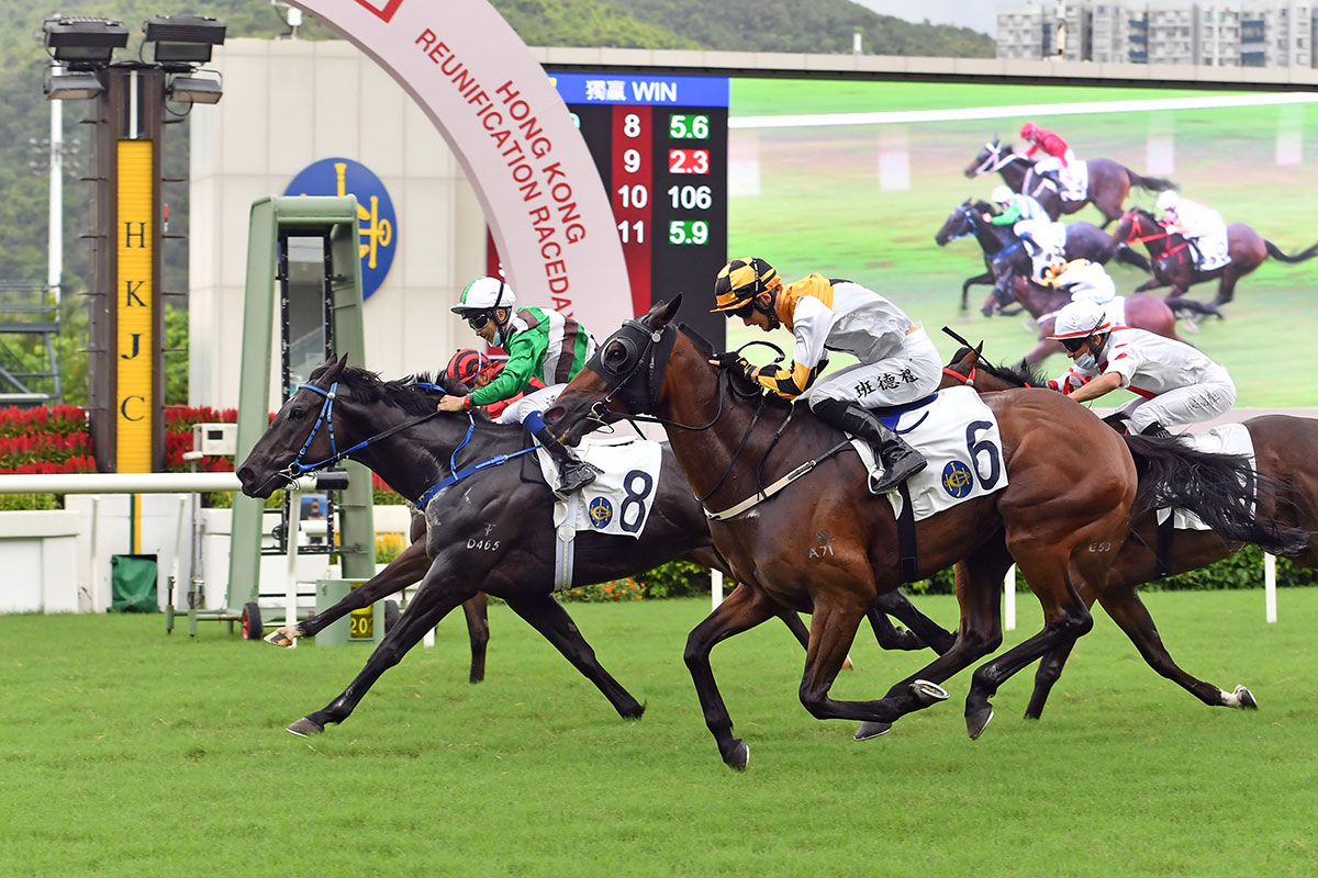 The Jimmy Ting-trained Super Football (No. 8), under Matthew Poon, wins The Hong Kong Reunification Cup at Sha Tin Racecourse today.