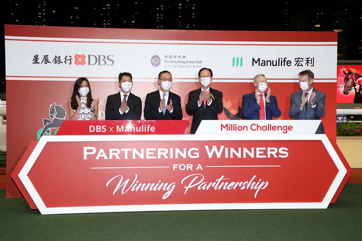 The 2021/22 season DBS x Manulife Million Challenge kicked off with an opening ceremony tonight. Officiating guests were (from left): Ms Tracy Leung, Vice President, Chief Partnership Distribution Officer, Manulife (International) Limited; Mr Wing Lo, Managing Director, Head of Bancassurance, Consumer Banking Group and Wealth Management, Hong Kong, DBS Bank (Hong Kong) Limited; Mr. Stanley Wu, Managing Director & Treasures & Distribution Head, Consumer Banking Group and Wealth Management, Hong Kong, DBS Bank (Hong Kong) Limited; Mr. Philip Chen, HKJC Chairman; Mr. Winfried Engelbrecht-Bresges, HKJC CEO; Mr. Andrew Harding, HKJC Executive Director, Racing.