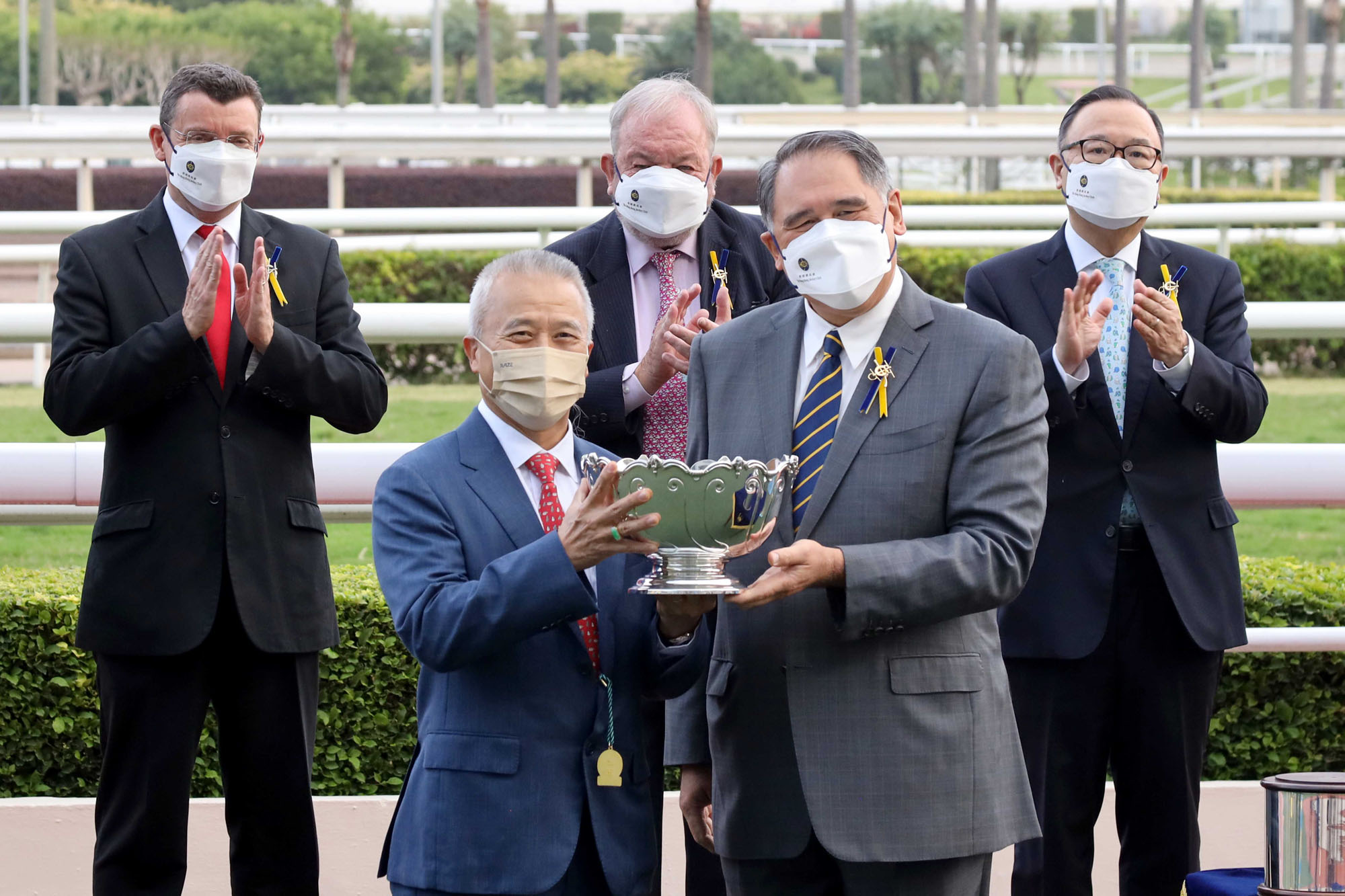 Mr Lester G Huang(right), Steward of the Club, presents the Premier Bowl Trophy and silver dishes to Wellington’s owner Michael Cheng Wing On and representative, trainer Richard Gibson and jockey Alexis Badel.