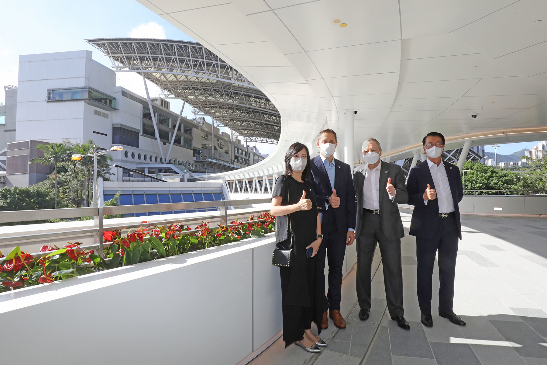 Chief Executive Officer Winfried Engelbrecht-Bresges (second right), Director of Property Philip Chen (first right), Director of Racing Operations Claus Weidner (second left) and Executive Manager, Ownership Management and The Racing Club Agnes Chung (first left) of The Hong Kong Jockey Club are pleased that the brand new P1 Car Park will open on 2 December 2022.