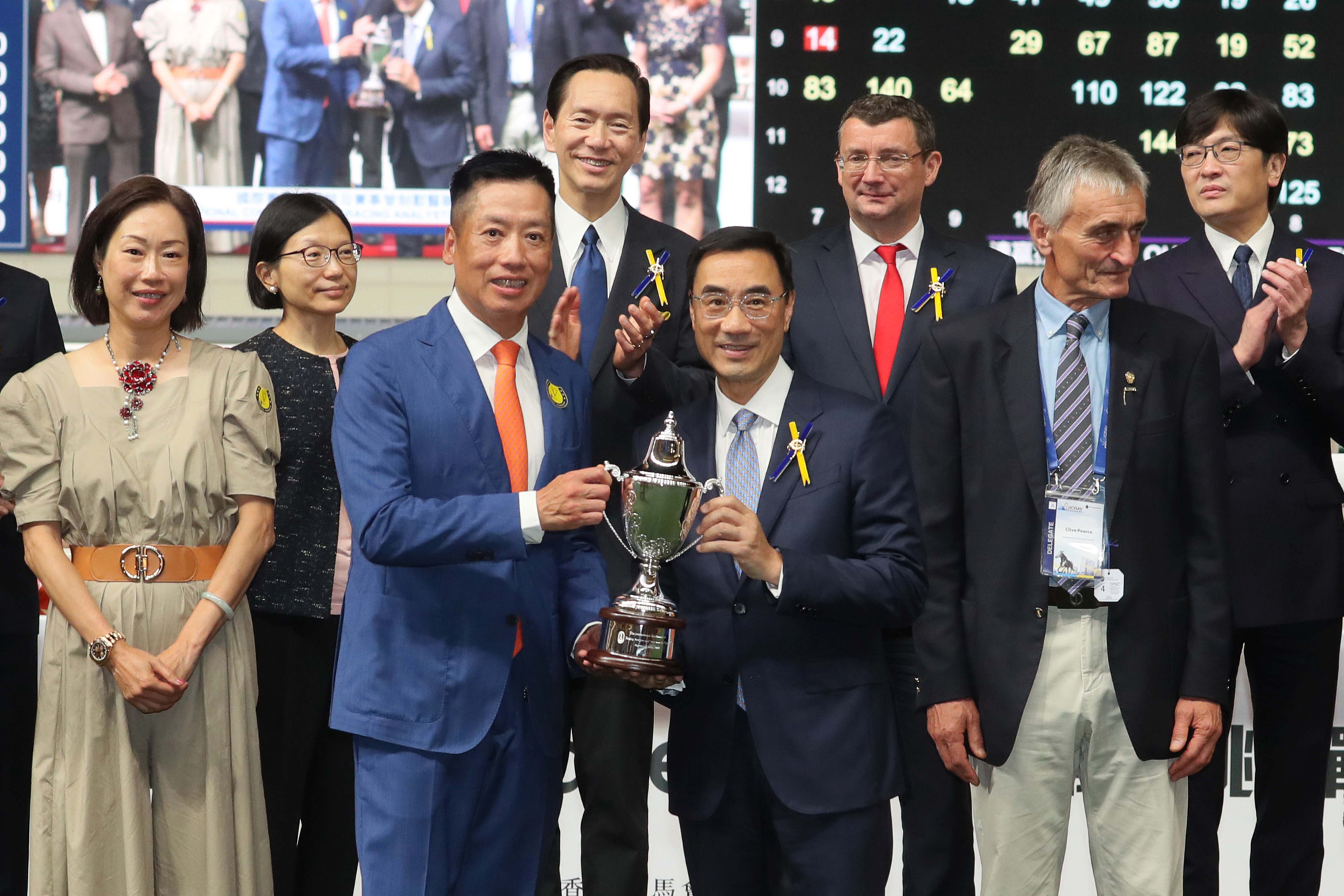 Mr Michael Lee (right), Chairman of The Hong Kong Jockey Club, presents the International Conference Of Racing Analysts And Veterinarians Cup to Mr. Eden Wong Chi Hong, Owner of Street Conqueror.